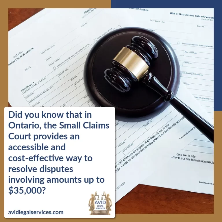 a gavel sitting on forms for small claims court on a wooden desk